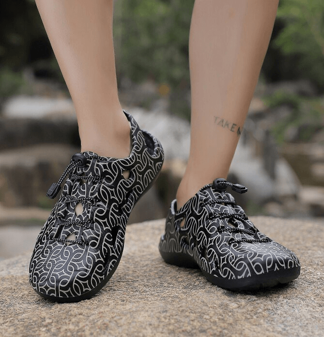 Black stylish men's quick dry clogs with patterned design, perfect for casual and beach wear.