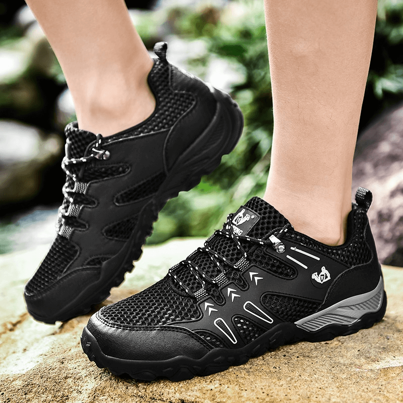 Black breathable mesh training sneakers with anti-slip sole, offering comfort and stability for active lifestyles.