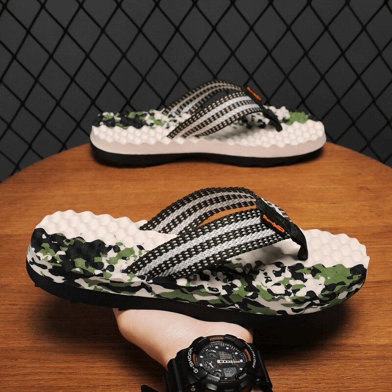 Stylish non-slip massage slippers for men with camo rubber soles, ideal for beachwear. Model SF1096 on display platform.