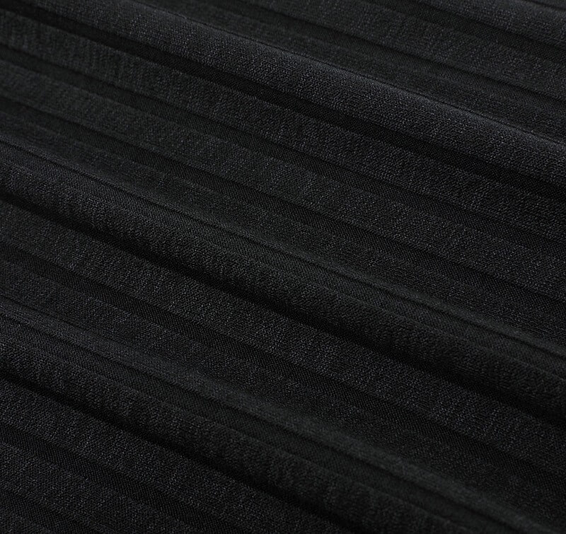 Close-up of black soft polyester fabric with subtle stripes, perfect for stylish slim-fit female polo t-shirts.