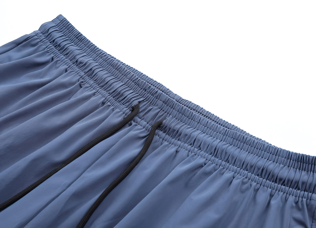 Close-up of stylish quick-drying sporty men's pants with elastic waistband and cuffs for running and training.