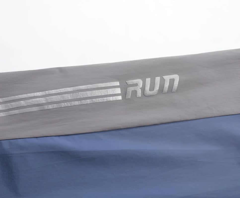 Close-up of stylish quick-drying sporty men's pants with "RUN" logo detail for training.