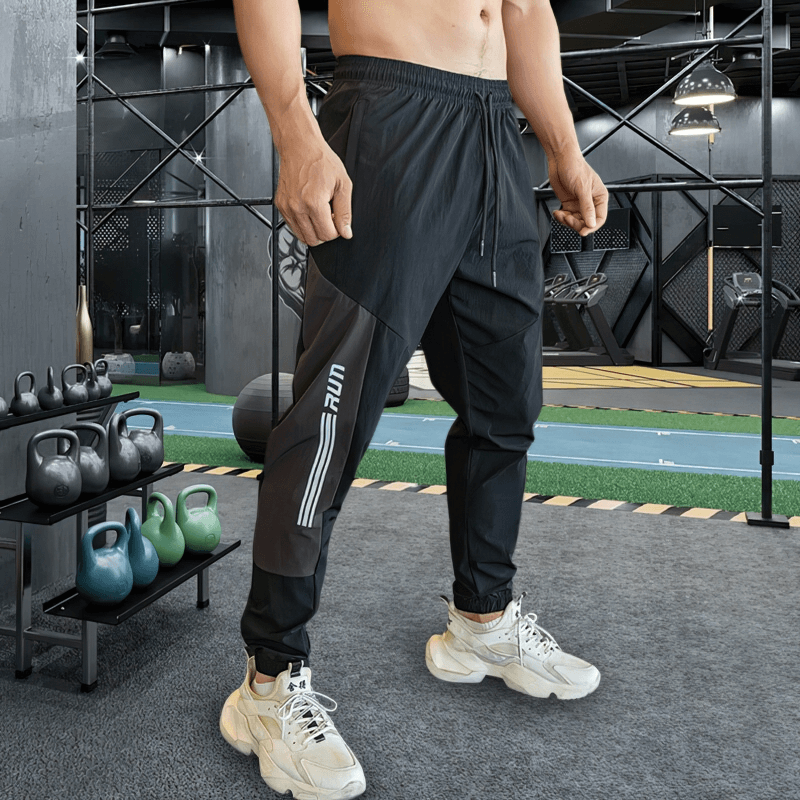 Stylish quick-drying men's sporty pants with cuffs for training in gym setting