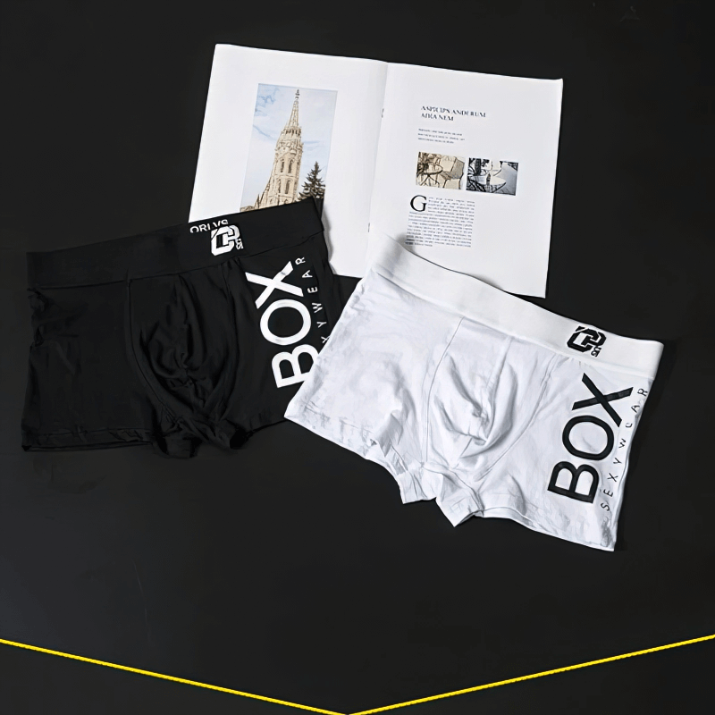 Black and white Stylish Soft Sports Men's Boxers SF0727 on display, offering breathable comfort and sleek style for men.