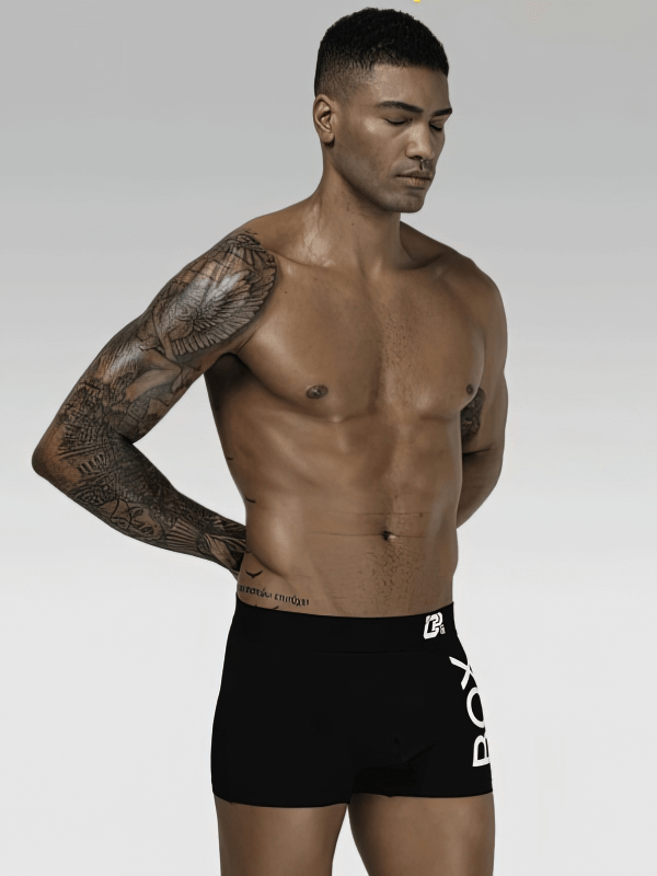 Model wearing stylish soft sports men's boxers, made of 100% cotton for comfort and breathability, perfect for a sleek, sporty look.