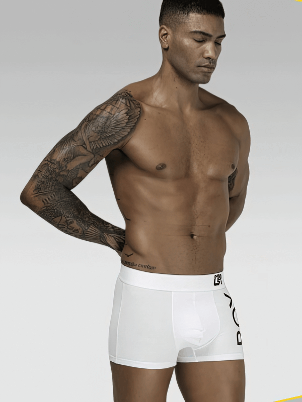 Stylish Soft Sports Men's Boxers in white, providing comfort and breathability with a sleek, sporty design. Model showing side view.