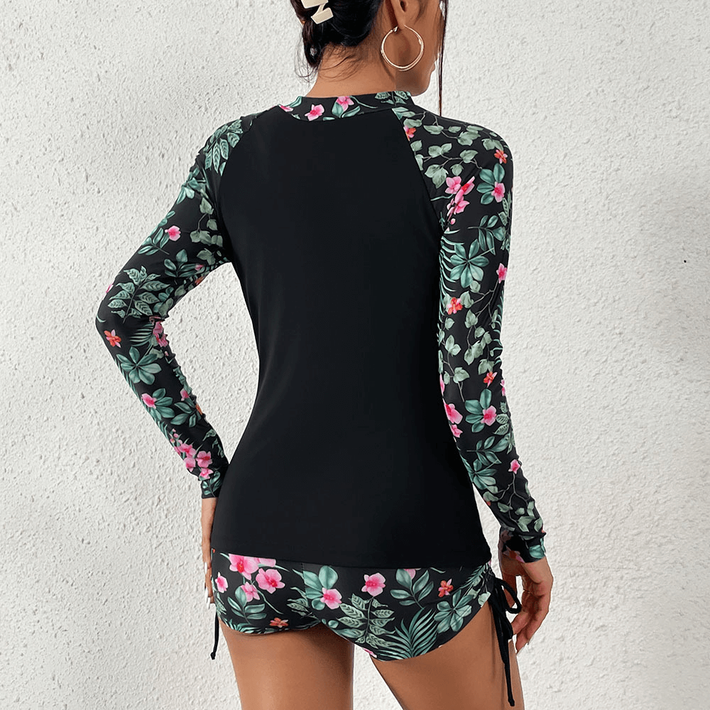 Back view of Stylish Split Women's Long Sleeve Swimwear SF0937 with floral sleeves, perfect for surfing and beach fun.