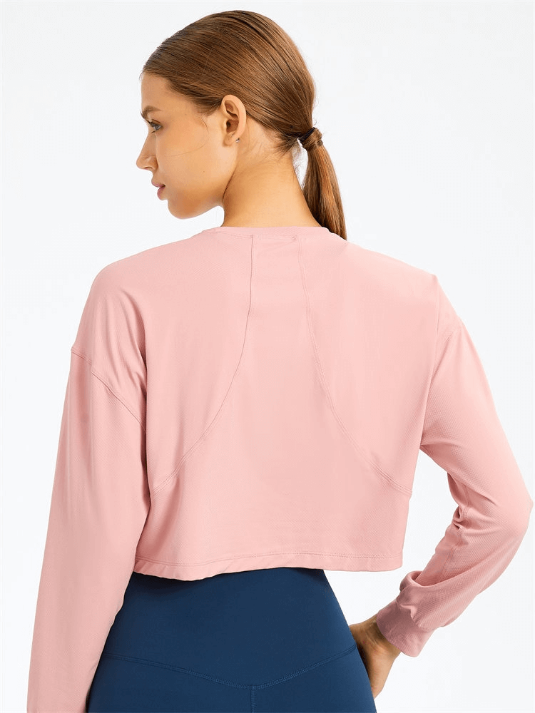 Back view of a pink, long-sleeve sport short women's sweatshirt ideal for yoga, featuring breathable spandex material and stylish design.
