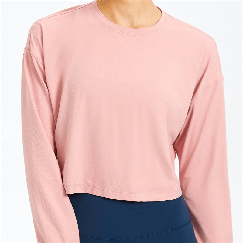 Pink stylish sport short women's sweatshirt with long sleeves, perfect for yoga and comfort in breathable spandex.