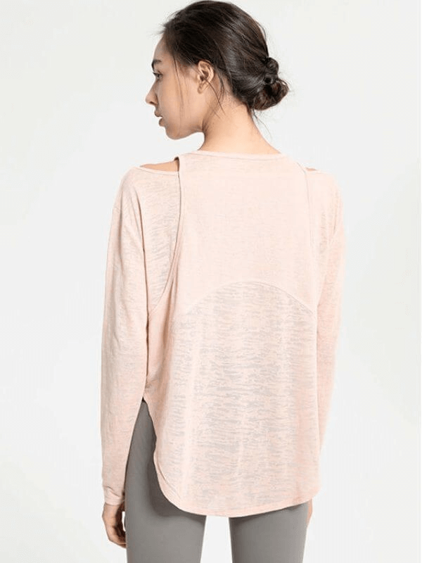 Back view of stylish sporty lightweight women's top with long sleeves and cutouts, perfect for yoga and movement.
