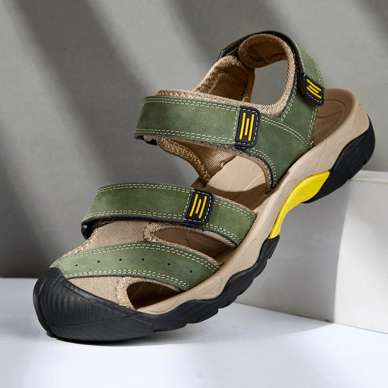 Stylish tactical leather men's sandal with adjustable Velcro, closed-toe design, and durable split leather upper in green.