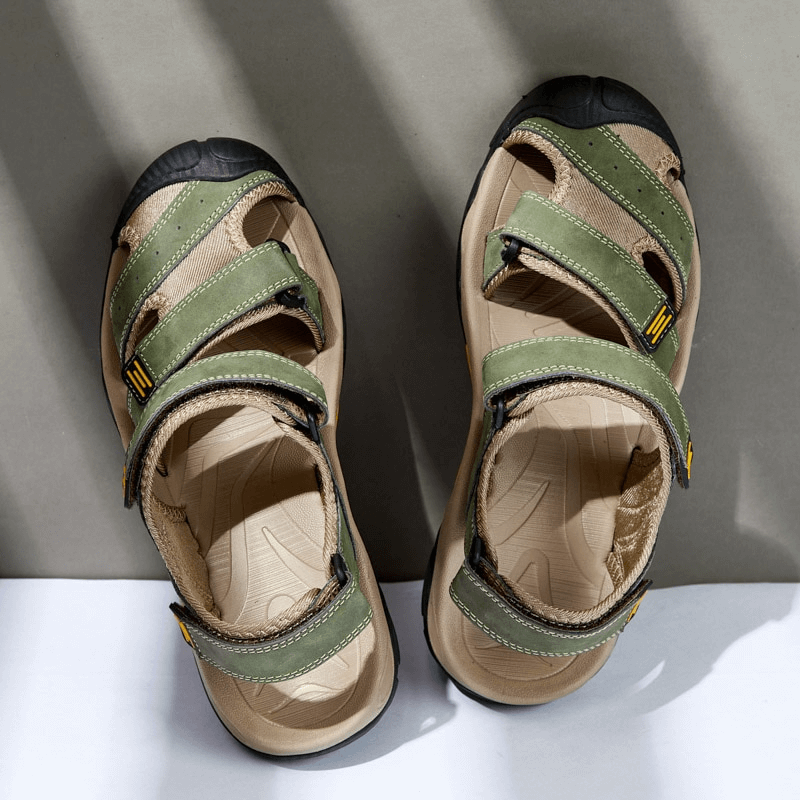 Green tactical leather men's closed toe sandals with Velcro straps on a grey background, style SF1102