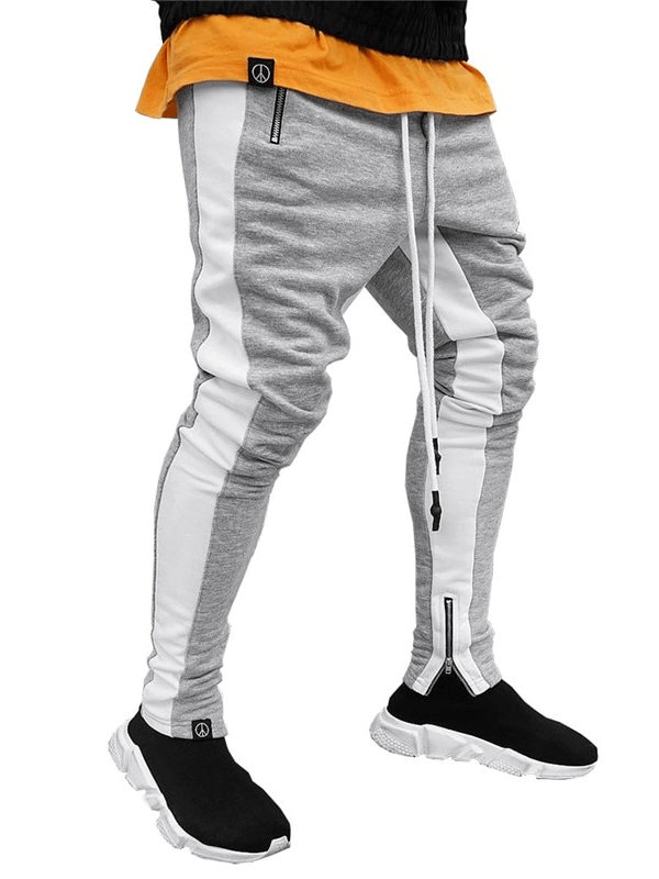 Men's stylish two-tone jogging pants with zipper pockets, made from breathable cotton for running, featuring drawstring and secure storage.