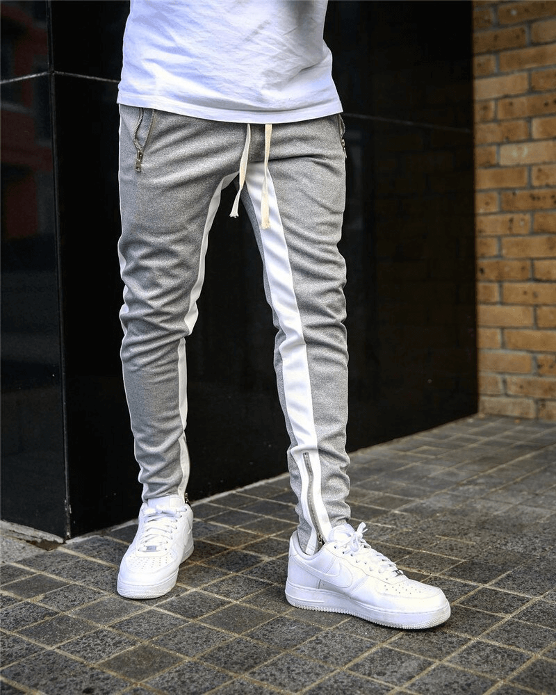 Men's stylish two-tone jogging pants with zipper pockets, perfect for running. Comfortable fit with drawstring closure. SF1133