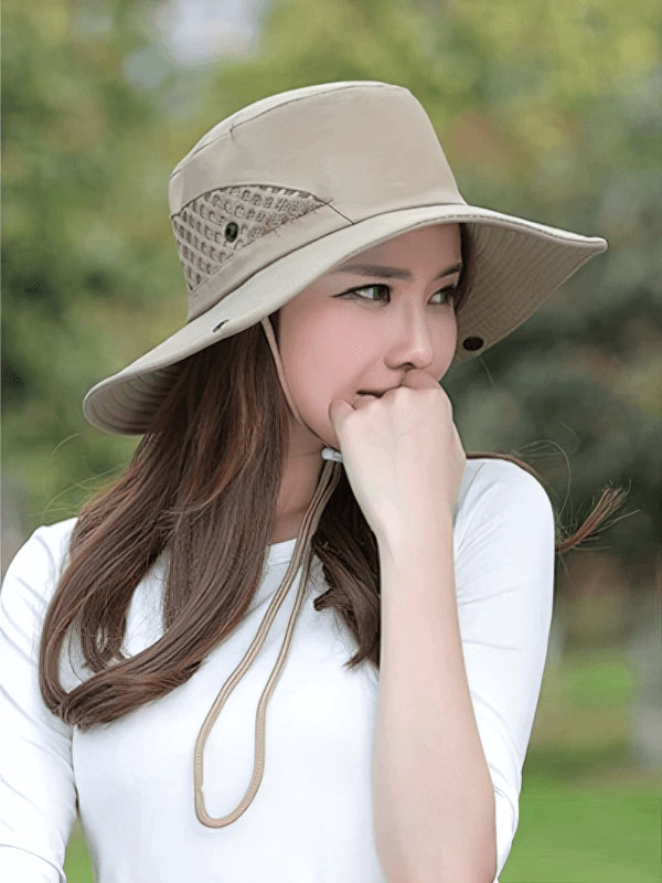 Woman wearing a stylish unisex breathable sun hat with adjustable brim, perfect for outdoor activities and sun protection.