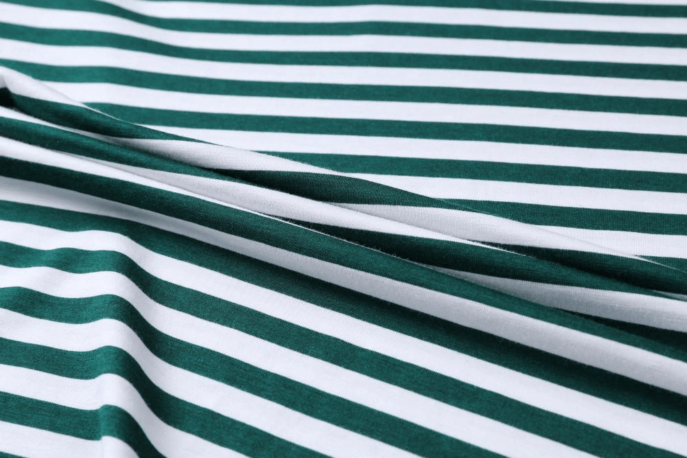 Close-up of green and white striped fabric, highlighting soft texture and stretch, perfect for men's v-neck sports tee, model SF1066.