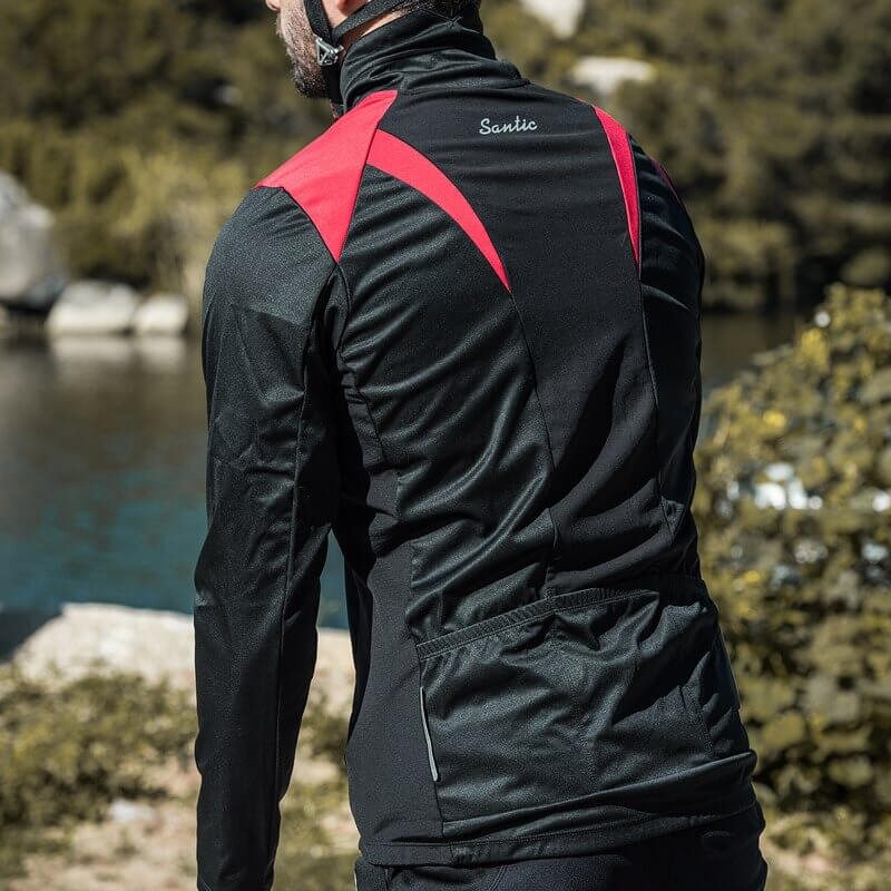 Man wearing stylish warm bike jacket with high slit pockets, back view by scenic river, features windproof and quick-dry materials.
