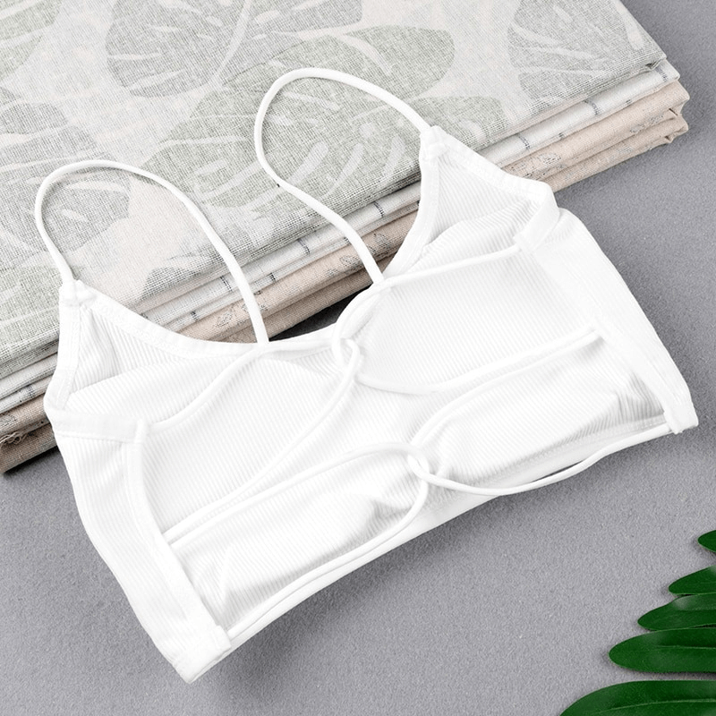 Stylish wireless women's sports bra with open back, white modal fabric, shown on cloth background, ideal for yoga and activities, SF0505.