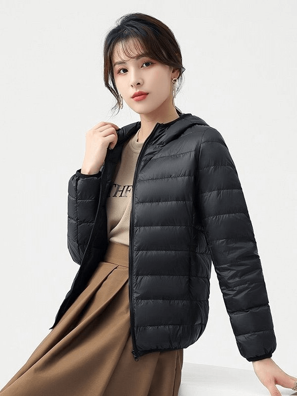 Stylish women's black down jacket with hood, lightweight and windproof. Perfect for outdoor activities. Model wearing SF0108.