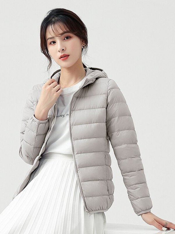 Stylish women's down jacket with hood in gray, featuring lightweight nylon and 90% down for warmth, perfect for outdoor activities.