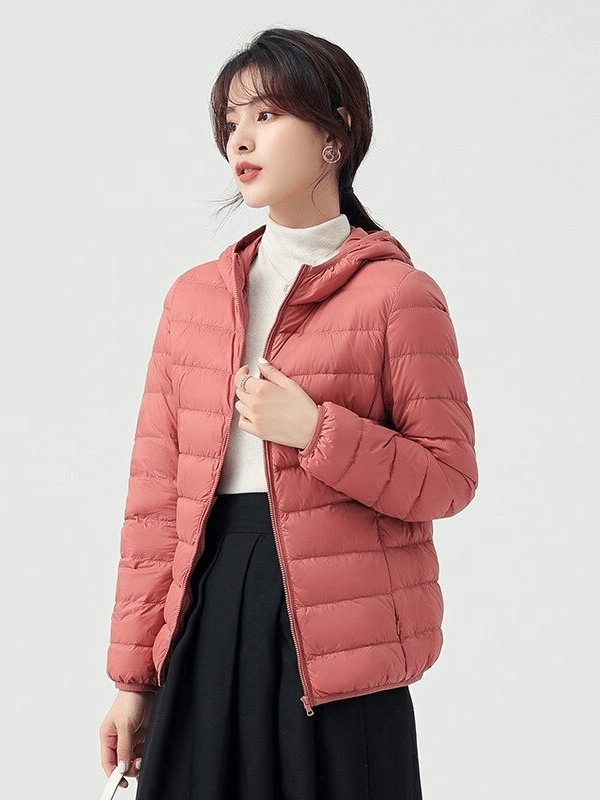 Stylish women's down jacket with hood, lightweight and warm, perfect for outdoor activities, insulated and windproof design.