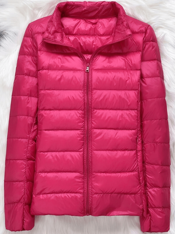 Vibrant pink women's down jacket without hood, featuring full sleeves and zipper closure. Perfect blend of style and warmth.