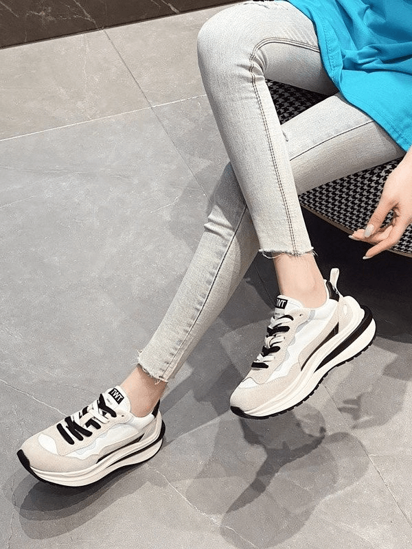 Stylish women's everyday sports sneakers with platform and lace-up closure for comfort and fashion-forward look.