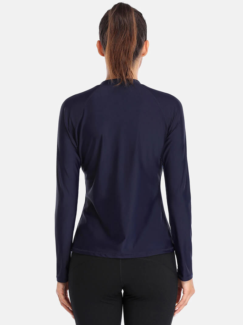 Back view of a stylish navy women's long-sleeve rashguard top, perfect for swimming, featuring a comfortable fit and durable design.