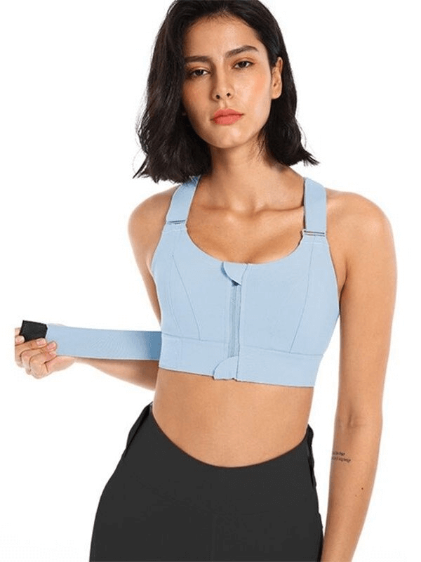 Woman wearing a blue shockproof sports bra with adjustable fastening, showcasing comfort and support for fitness activities - SF0445.
