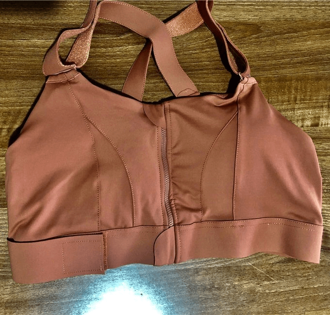 Stylish Women's Shockproof Sports Bra with Adjustable Fastening in rust color, perfect for comfortable and supportive workouts.