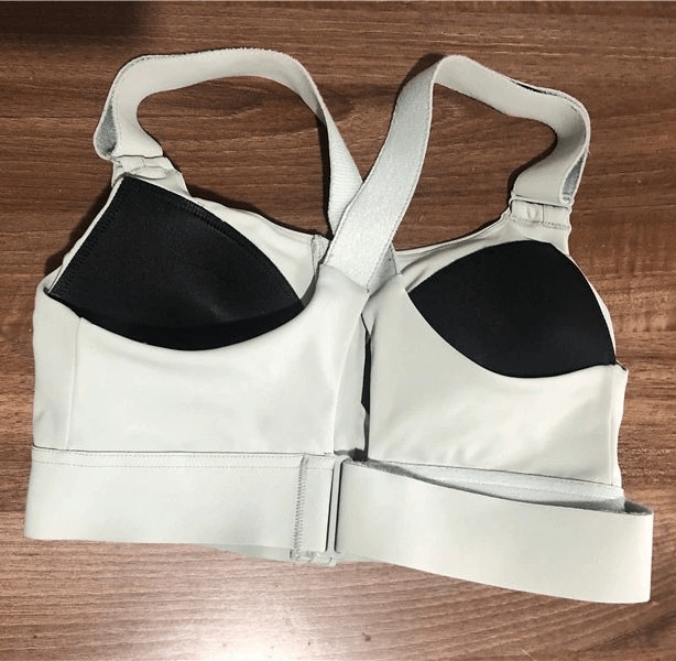 Stylish Women's Shockproof Sports Bra SF0445 on display, featuring adjustable fastening and breathable poly-spandex fabric for comfort.