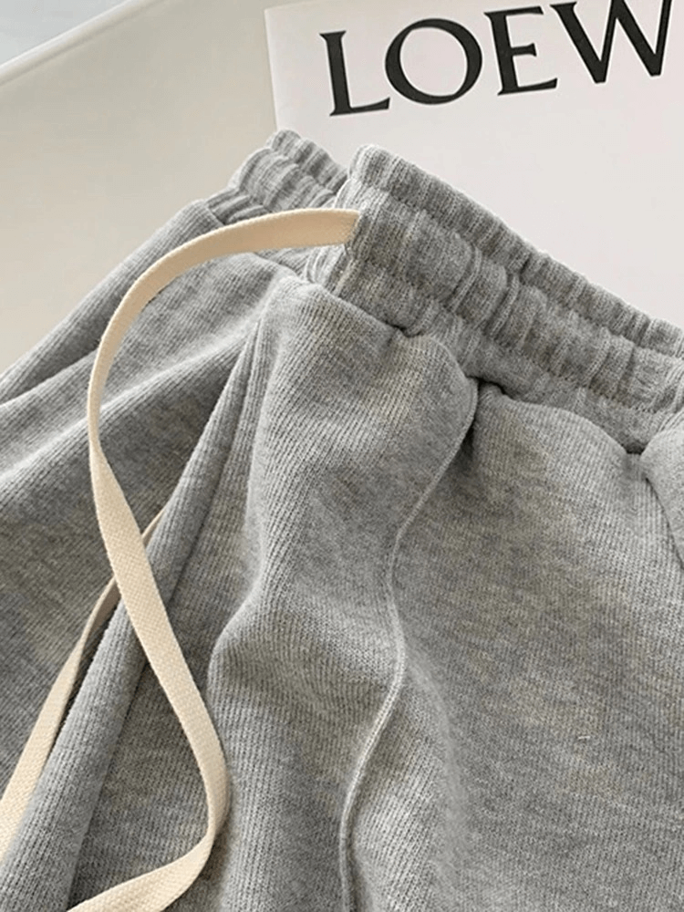 Stylish women's high-waist gray shorts with side pockets and elastic band, perfect for casual wear. SF0181.