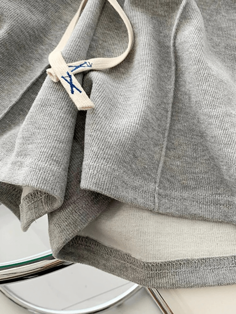 Close-up of stylish womens shorts with high waist, side pockets, and elastic waistband in premium cotton fabric, color gray, SF0181.