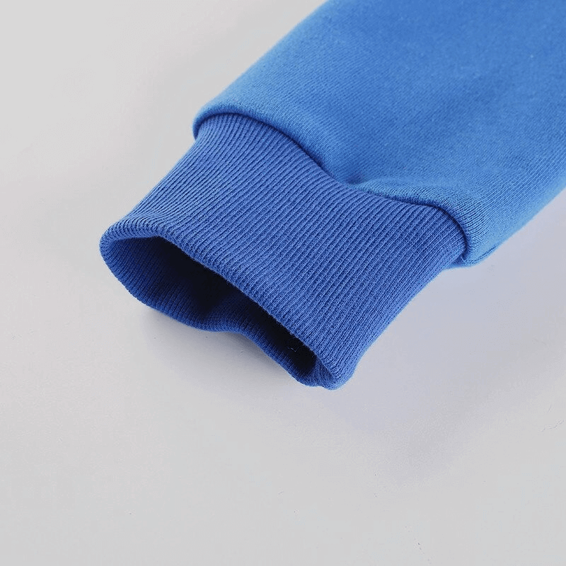 Cropped blue sleeve of women's sports hoodie with cuff detail, showcasing quality fabric ideal for yoga and fitness workouts.