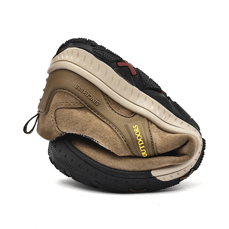 Flexible suede leather non-slip hiking shoe with elastic band, rolled to show durability and outdoor-ready traction.