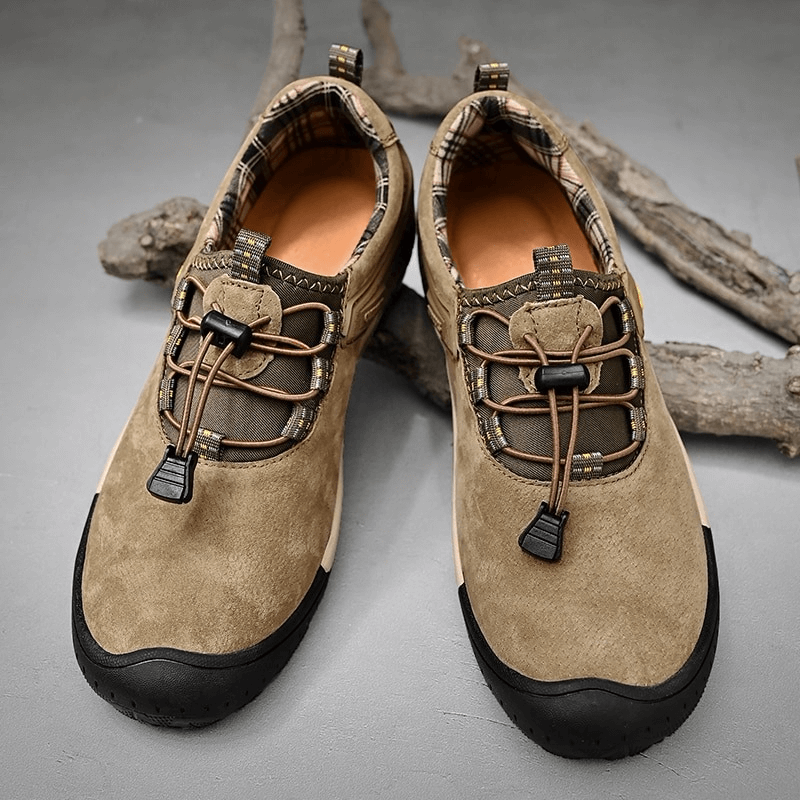 Suede Leather Non-Slip Hiking Shoes for Men with Elastic Band, perfect for outdoor adventures, shown on rustic wood background.