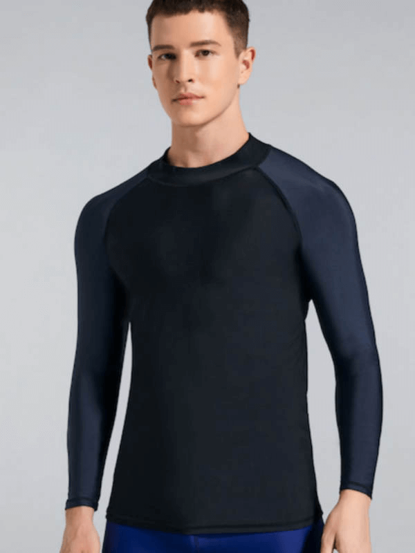 Man wearing a black Sun Protection Compression Shirt for swimming and sports, offering UV protection and made of breathable material.