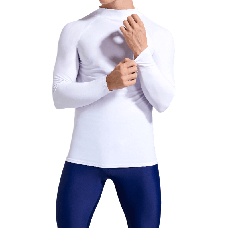 Man wearing white compression shirt for swimming and sports with sun protection and UV coverage, ideal for surfing and martial arts.
