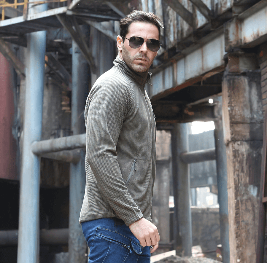 Man wearing Tactical Lightweight Fleece Jacket SF0350, warm army clothing in urban setting, showcasing style and functionality.