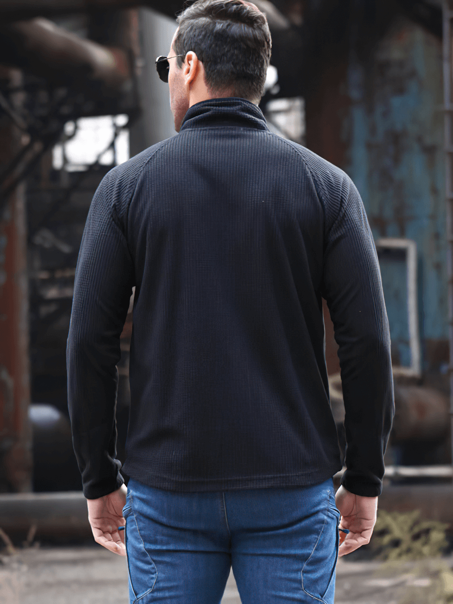 Back view of man wearing tactical lightweight fleece jacket in Black, showcasing warmth and style for army and outdoor activities.
