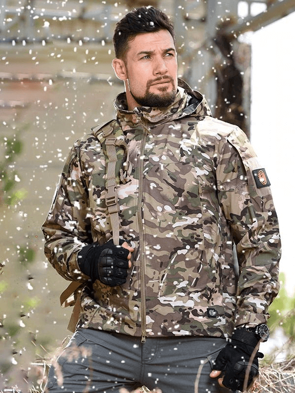 Man wearing Tactical Waterproof Men's Fleece Jacket SF0684 in snowy outdoors, highlighting its camo pattern and durability.