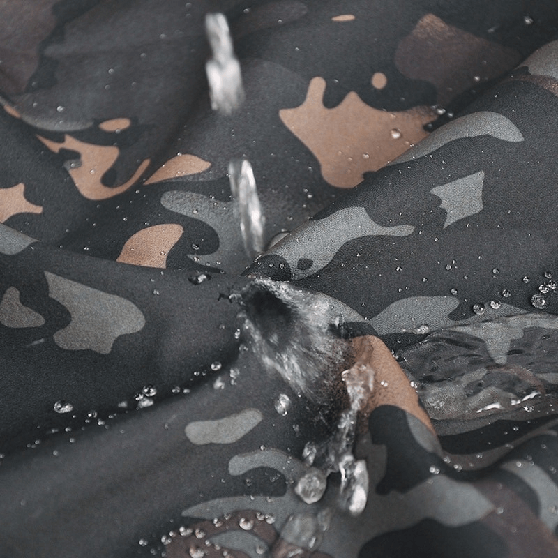 Close-up of waterproof camo fabric demonstrating water resistance of Tactical Men's Fleece Jacket SF0684, perfect for outdoor sports.