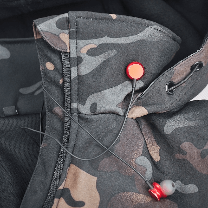 Close-up of camo Tactical Waterproof Men's Fleece Jacket with headphone jack and fleece lining.
