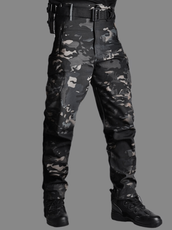 Men's tactical waterproof pants in camo, featuring quick-dry and windproof technology for outdoor adventures like hiking and camping.