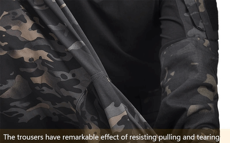 Close-up of durable tactical waterproof pants in camo, showcasing tear resistance for rugged outdoor use.