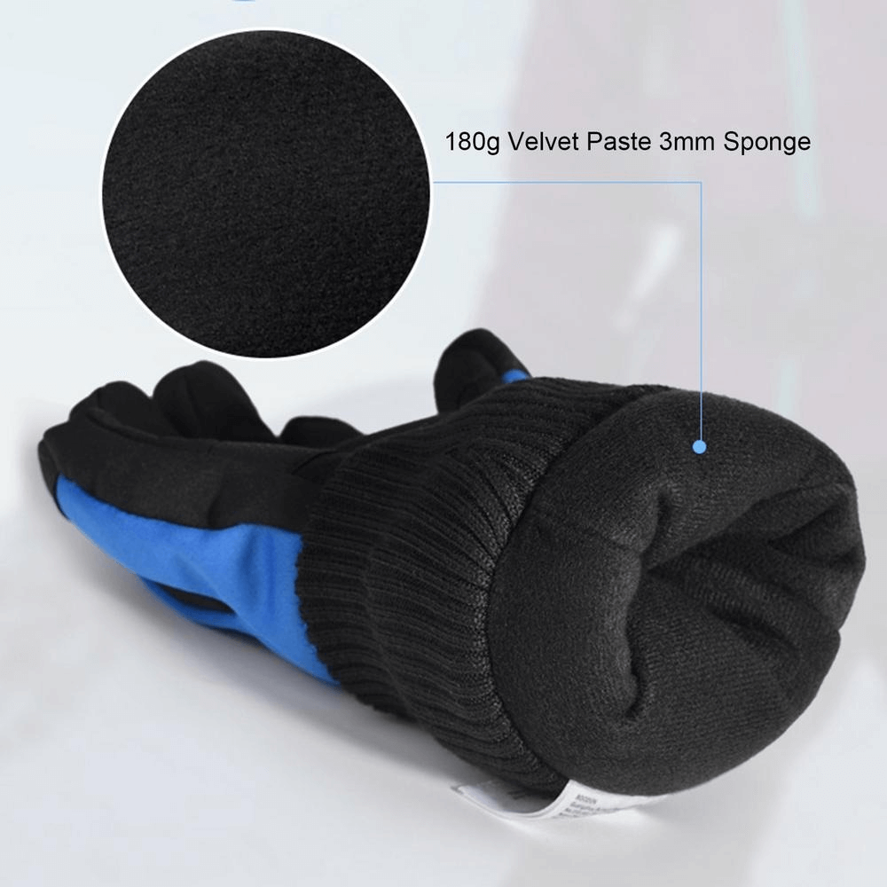 Close-up of thick waterproof mountaineering gloves showcasing velvet paste and sponge padding.