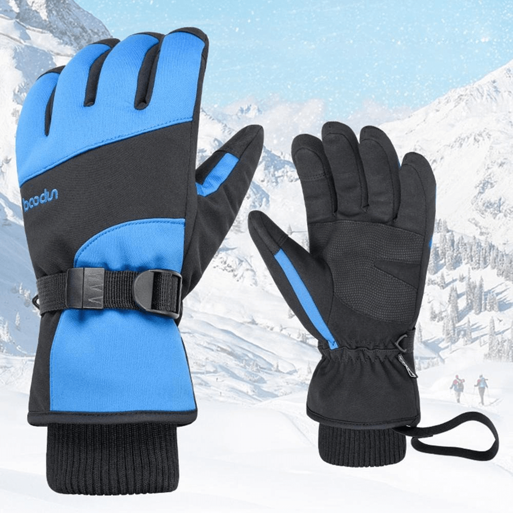 Thick waterproof mountaineering gloves with wrist rope on snowy mountain backdrop, ideal for outdoor adventures.