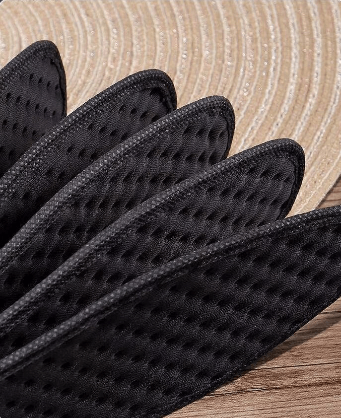 Black antibacterial sports insoles with textured design, perfect for shock absorption and comfort in athletic shoes.