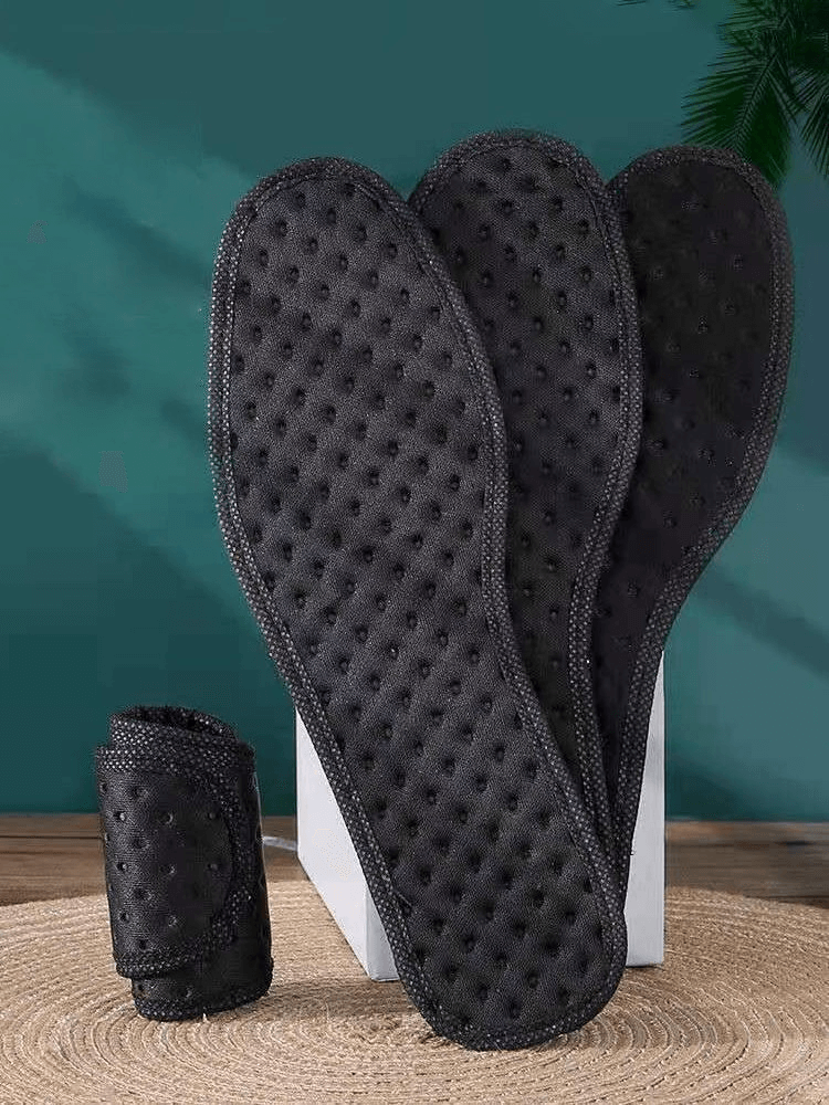 Black thickened shock absorbing antibacterial insoles for sports shoes displayed on a stand, showcasing their texture and quality.
