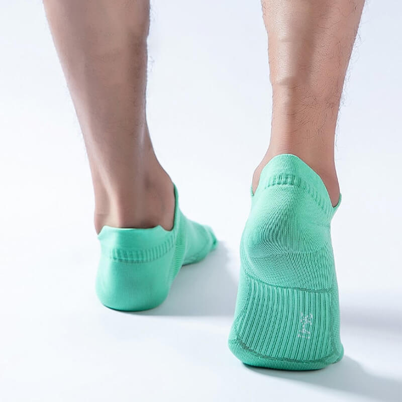 Person wearing thin anti-slip breathable sports socks in green, ideal for running, showing back view for design and fit.